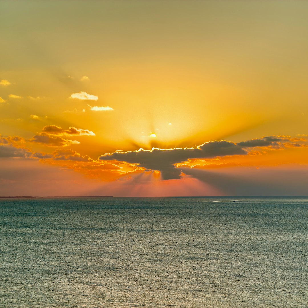 federal prison reentry — Sunset over a calm ocean with dramatic rays