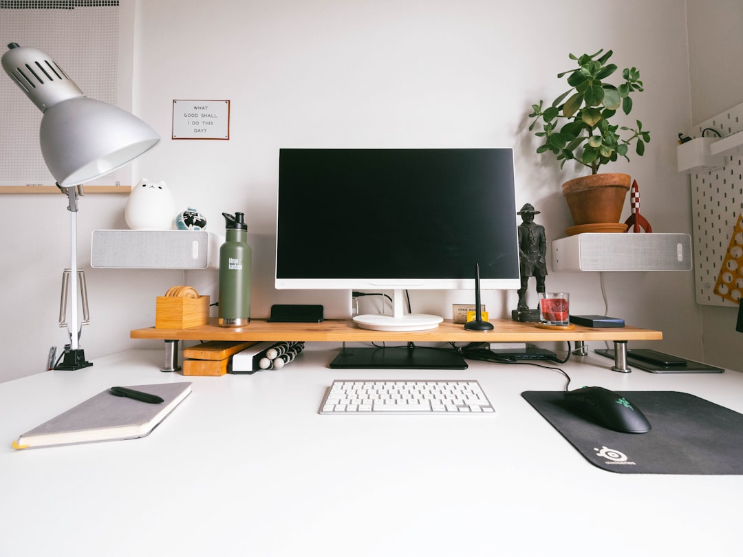 job search federal conviction — silver imac on white wooden desk